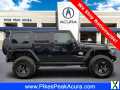 Photo Used 2014 Jeep Wrangler Unlimited Rubicon w/ Connectivity Group